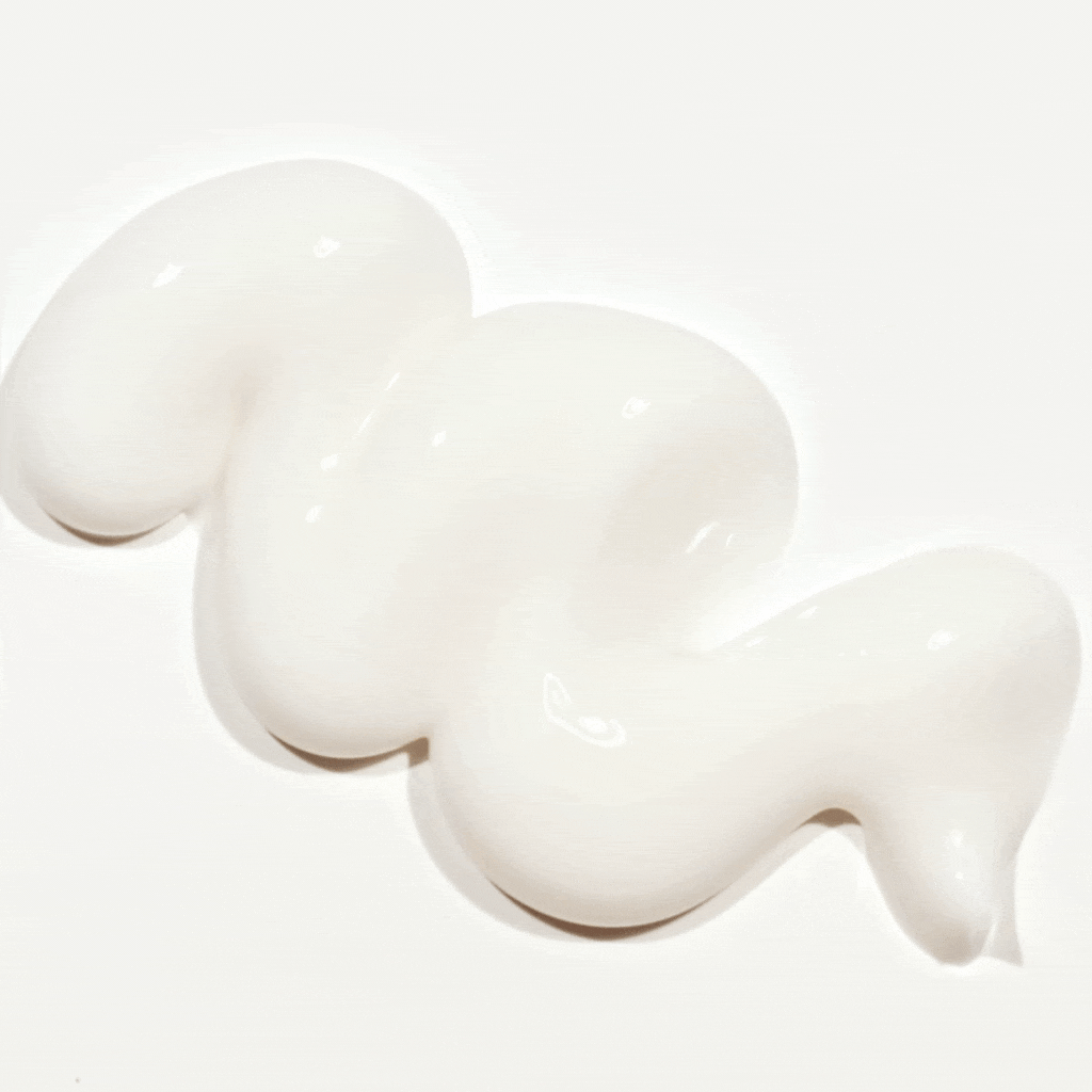 Close-up of Post-Whitening Toothpaste texture showing thick, smooth white cream swirl on a flat surface
