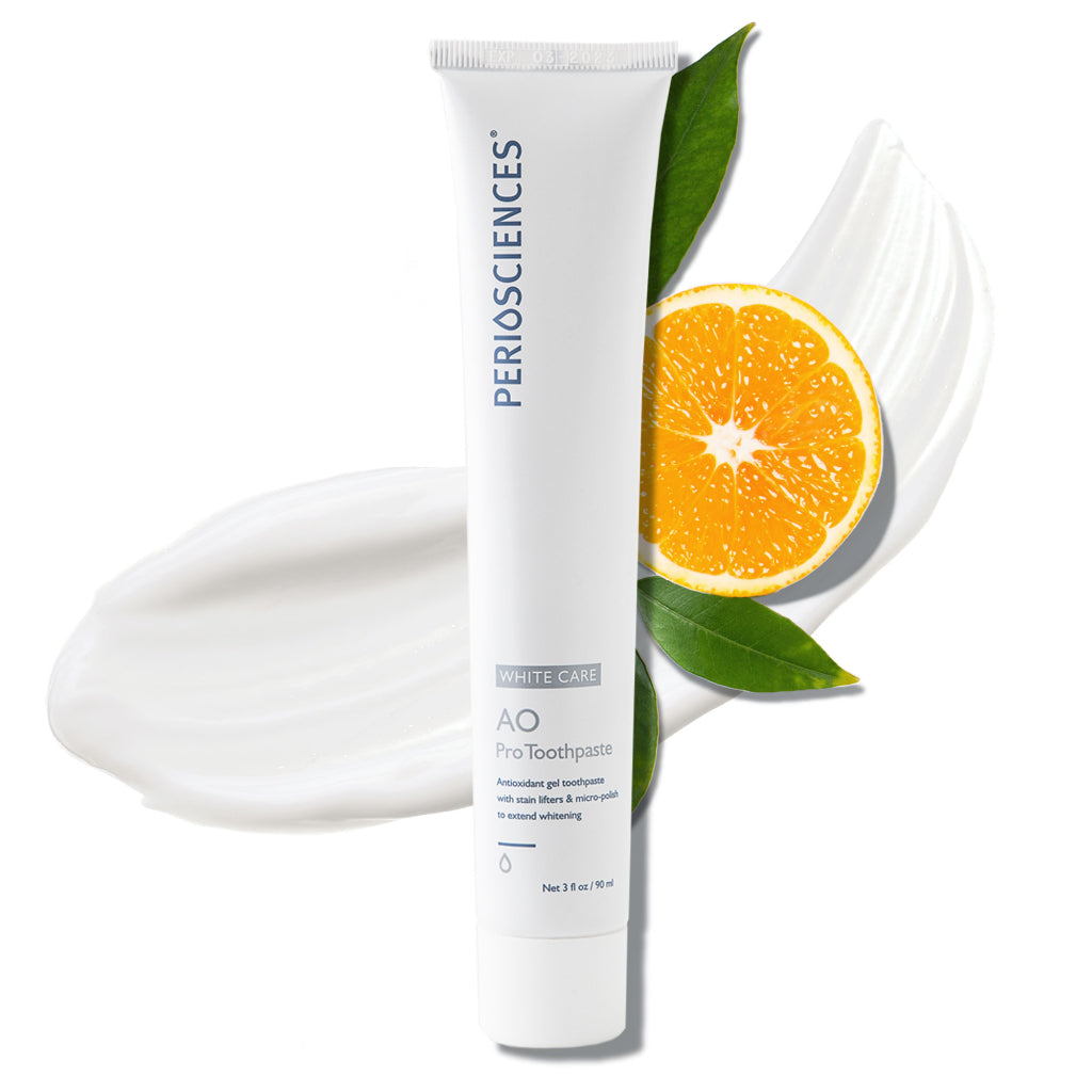 PerioSciences Post-Whitening Toothpaste white 3 fl oz tube with gel swatches, orange slice, and green leaves